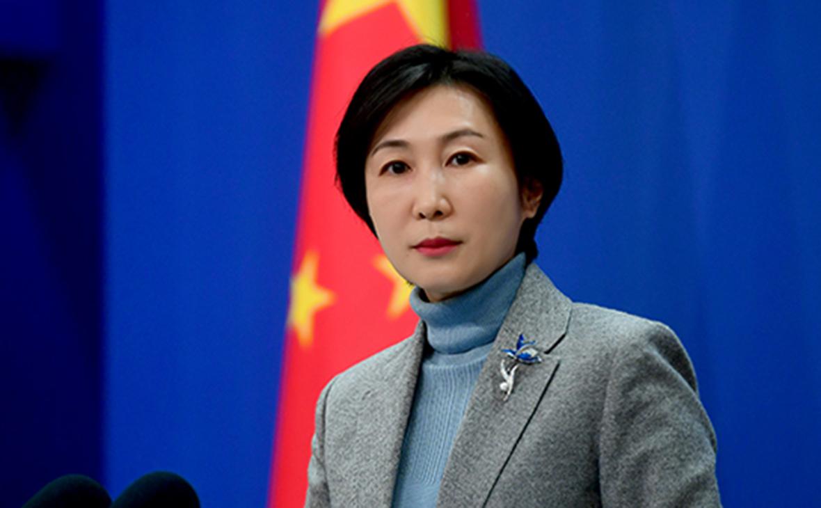 China denies pressuring others not to attend