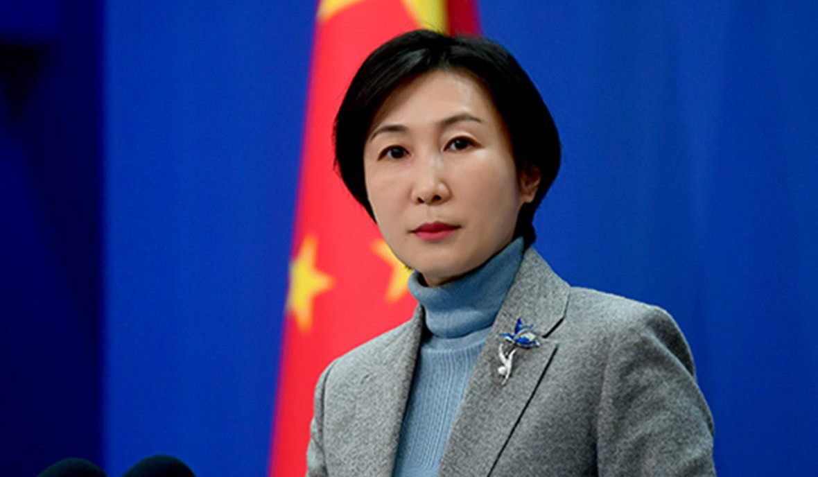 China denies pressuring others not to attend