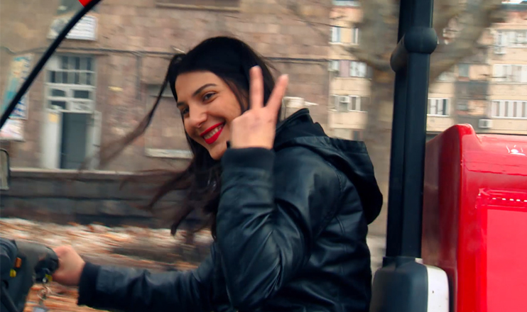 Dark-haired Heghine breaks the stereotypes riding a moped